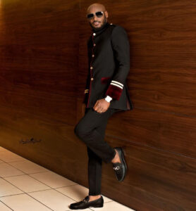 2face Idibia holds wife, Annie Idibia's shoes for her as they left the Headies award ceremony (video)