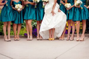 The New Trend Of Bridesmaids Rocking Sneakers On A Wedding Train