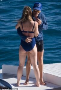 Harry Styles, 27, and girlfriend Olivia Wilde, 37, passionately kiss while enjoying a romantic day onboard a yacht in Tuscany