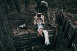 Russia-Ukraine War: Popular Ukrainian Sniper Gets Married On The Frontline To A Soldier While Wielding Machine Gun (Photos)